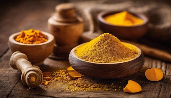 Fresh ground turmeric in a wooden bowl whcih may cause side effects after consumption