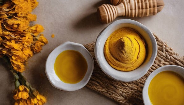 A bowl of Turmeric sitting on a table for use on the skin